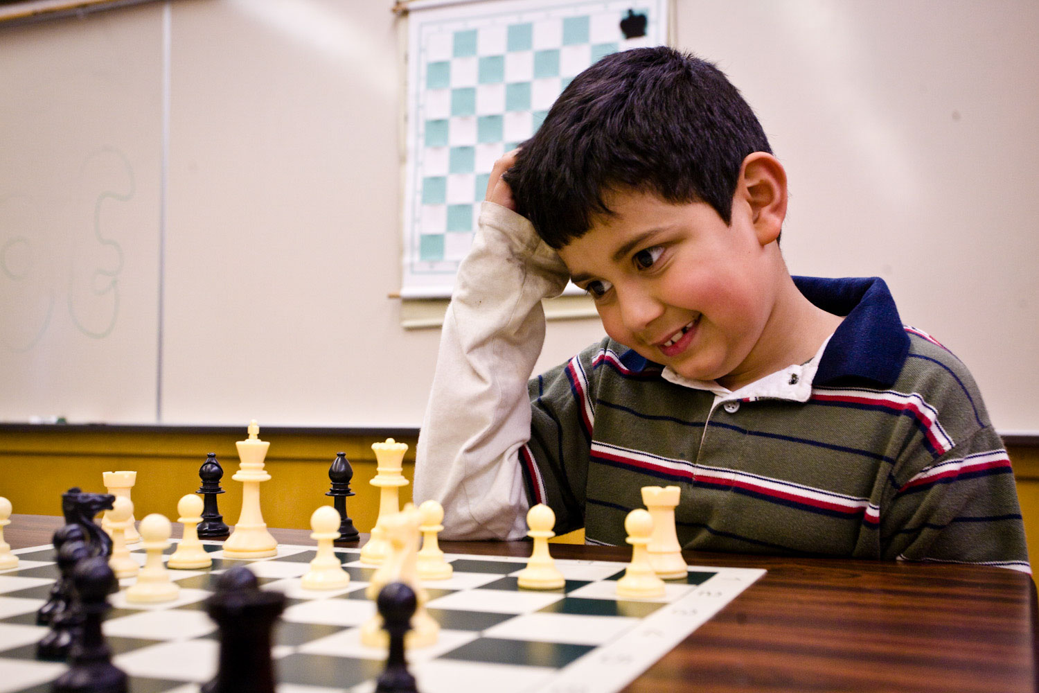 Brayan Moreno-Loa sits chess board scratching his head